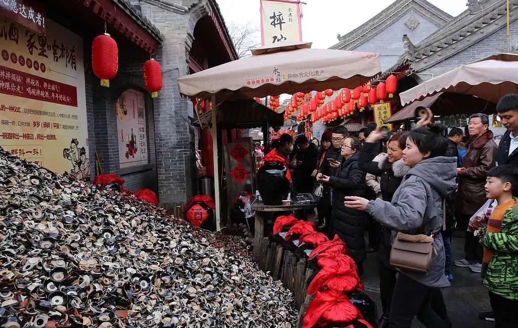 西安摔碗酒的地址在哪里，西安城墻腳下的永興坊